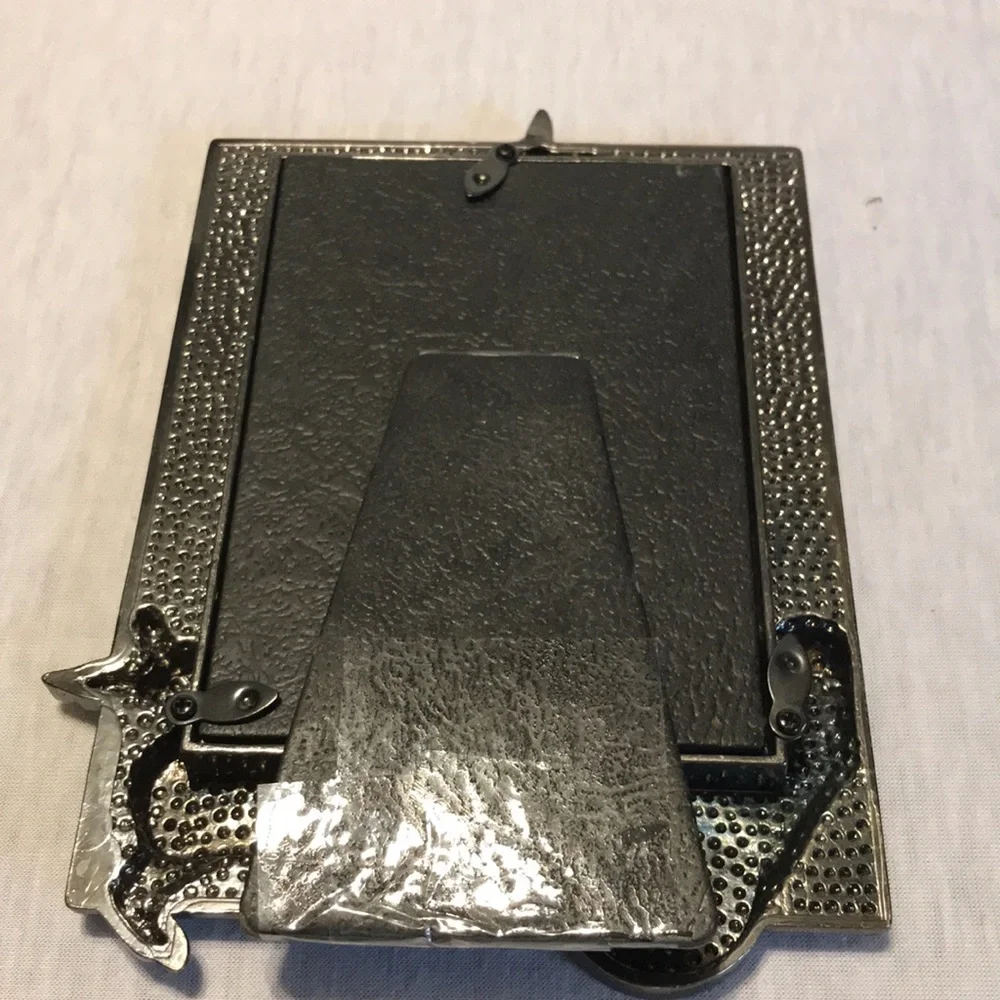 Silver metal rabbit with wheel barrel of eggs picture frame.